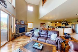 a living room with a couch and a table at San Juan Siesta in South Fork