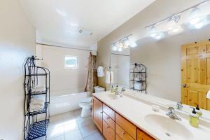 a bathroom with a sink and a tub and a toilet at San Juan Siesta in South Fork +34 photos