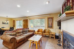 a living room with a couch and a table at On the Rapids - B Unit in Grand Lake