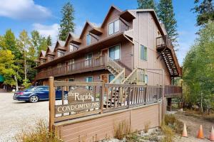 a building with a sign in front of it at On the Rapids - B Unit in Grand Lake