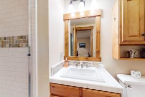 a bathroom with a white sink and a mirror at The Lodges 1145 in Mammoth Lakes +83 photos