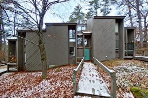 a house with a tree in front of it at North Conway Condo in North Conway