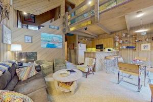 a living room with a couch and a table at North Conway Condo in North Conway