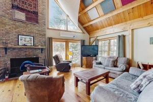a living room filled with furniture and a fireplace at Blue Goose in Ludlow