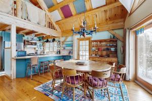 a large kitchen with a wooden table and chairs at Blue Goose in Ludlow