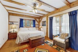 a bedroom with a bed and a ceiling fan at Blue Goose in Ludlow