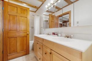 a bathroom with a sink and a large mirror at Blue Goose in Ludlow +47 photos