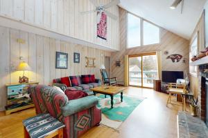 a living room with a couch and a table at West Dover Getaway in West Dover