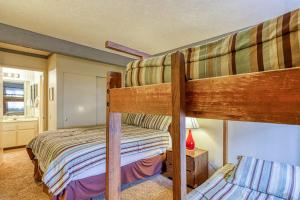 a bedroom with two bunk beds in a house at Mammoth Ski & Racquet 124 in Mammoth Lakes +99 photos