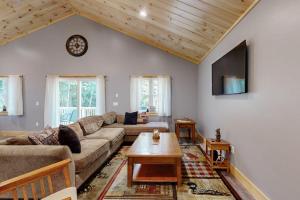 a living room with a couch and a table at Kenny in Wolfeboro