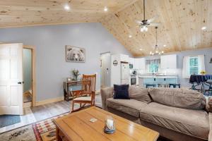 a living room with a couch and a table at Kenny in Wolfeboro