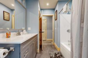 a bathroom with a sink and a tub and a shower at Kenny in Wolfeboro +52 photos