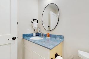 a bathroom with a sink and a mirror at Green Mountain Zen in Ludlow +41 photos
