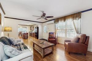 a living room with a couch and a table at Stargazing Daydreamer in Arlington