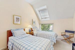 a bedroom with two beds and a window at South Village #8 in Warren +47 photos