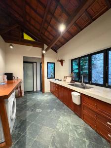 a large kitchen with a sink and a counter at Half Village, Nha Trang in Nha Trang