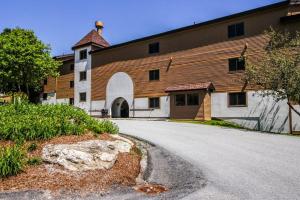 a large building with a road in front of it at Okemo Mountain Condo in Ludlow