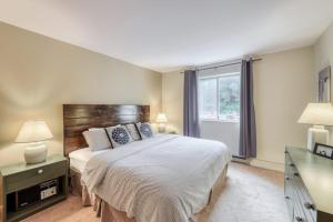 a bedroom with a large bed and a window at You, Me, & the Mountain in Warren +34 photos