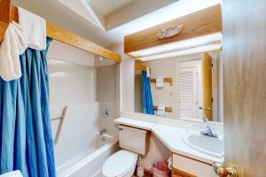 a bathroom with a tub and a sink and a toilet at Vermont Paradise in Warren +14 photos