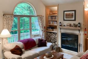 a living room with a couch and a fireplace at Secluded Sanctuary in West Wardsboro