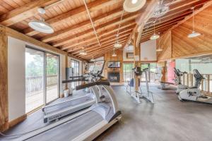 a gym with treadmills and elliptical machines at Mountainside Resort V in Stowe