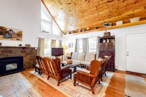 a living room with a fireplace and a table and chairs at Ludlow Hideout in Ludlow