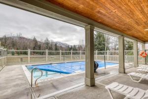 an outdoor swimming pool with a wooden ceiling at Owls Unit #6 in Jeffersonville