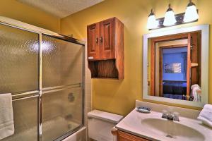 a bathroom with a shower toilet and a sink at Kettle Brook G in Ludlow