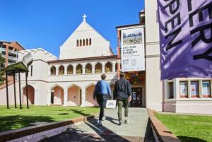 two people walking in front of a building at Private Coastal Sanctuary Beachside Escape in Bunbury +1 photo