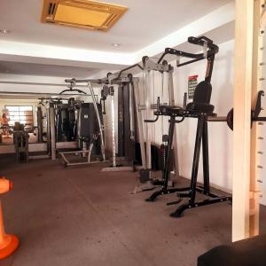 a gym with several treadmills and machines at Sport Villa Condo in Hua Hin