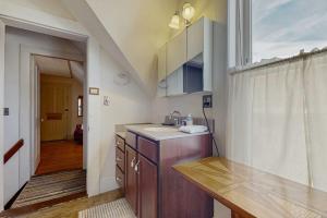 a kitchen with a sink and a counter top at Pleasant Street 43 in Ludlow +36 photos