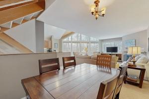 a dining room and living room with a table and chairs at Southface #35 in Warren