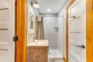 a bathroom with a sink and a bath tub at Lake Rescue Escape in Ludlow +63 photos