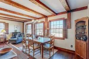 a dining room with a table and chairs at Vermont Mountain Farmhouse in Ludlow
