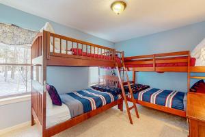 a bedroom with two bunk beds and a window at Winterplace Condos H in Ludlow +29 photos