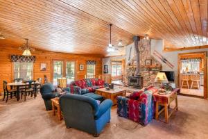 a large living room with couches and a fireplace at The Breck House in Breckenridge
