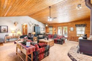 a large living room with couches and a tv at The Breck House in Breckenridge