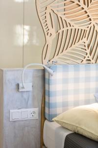 A bed or beds in a room at Mediterraneo Suite Home