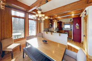 a kitchen and dining room with a table and chairs at Hilltop Palace in Fraser