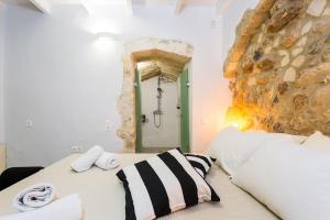 Ένα ή περισσότερα κρεβάτια σε δωμάτιο στο Mediterraneo Suite Home