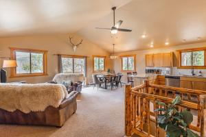 a large living room with a couch and a kitchen at Mountain Calling in Grand Lake