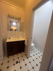 a bathroom with a sink and a mirror at Questro Lodge in Kalbarri +23 photos