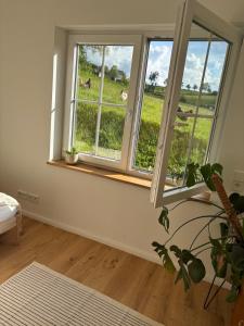 a room with a window with a view of a field at Landidylle in Wenden Schönau in Wenden