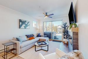 a living room with a couch and a tv at Mellow on Meadow Mile 2A in Fraser