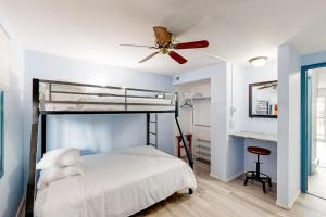 a bedroom with a bed with a ceiling fan at Mountain Delight in Crested Butte +48 photos