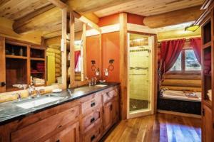 a bathroom with a sink and a tub in a cabin at South Fork Sanctuary in South Fork +36 photos