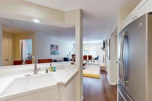 a kitchen with a sink and a refrigerator at River Pines Retreat in Edwards +43 photos