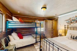 a bedroom with two bunk beds in a house at Shadow Mountain Marina in Grand Lake