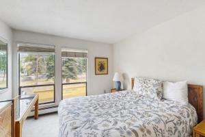 a bedroom with a bed and a window at Lake Cliffe 209F in Dillon +32 photos