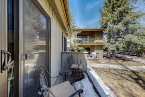 a porch with a bench and a house at Flying Dutchman 1202 in Keystone